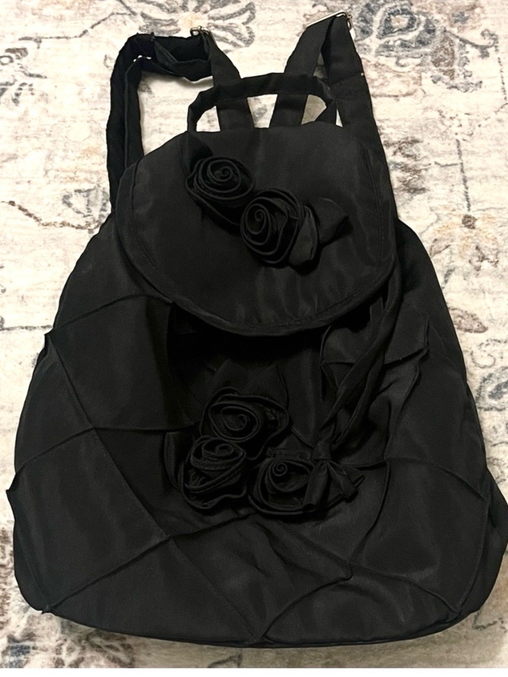 Joy Susan mini Black Quilted Backpack with Rosette Accents